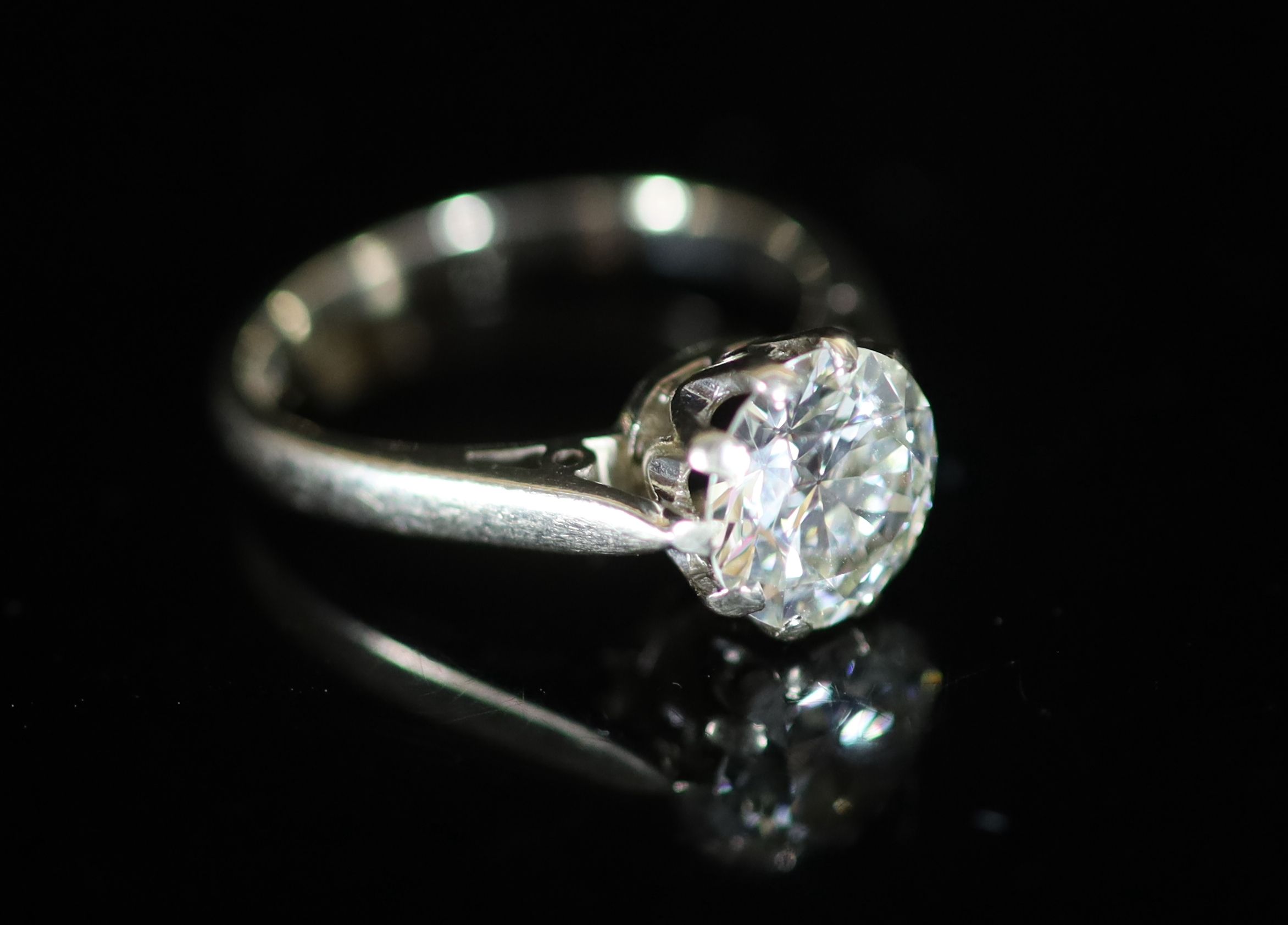 A modern 18ct white gold and solitaire diamond ring